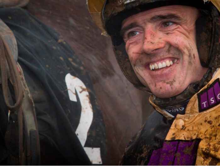 Ruby Walsh smiles after dismounting horse