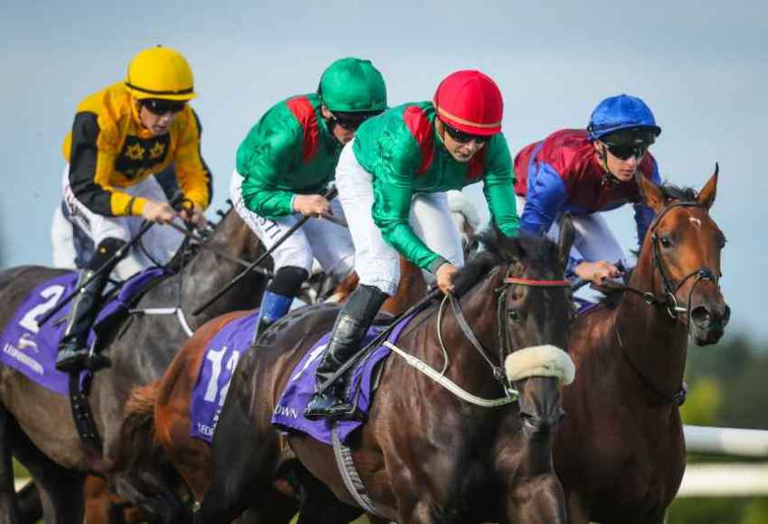 Jockeys grouped together during a race