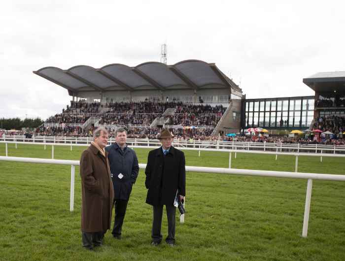 Gordon Elliott, J.P McManus, and Frank Berry watch on at Fairyhouse racetrack