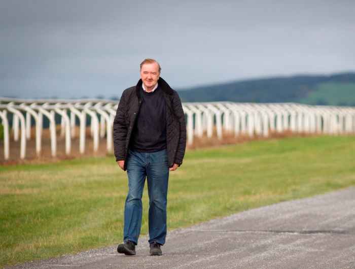 Dermot Weld pictured beside the gallops