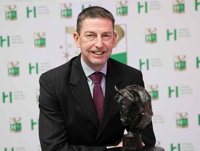 Gavin Cromwell smiles for camera as he wins HRI awards