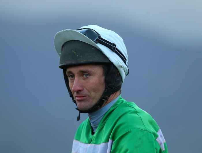 JT McNamara close up shot wearing jockey silks