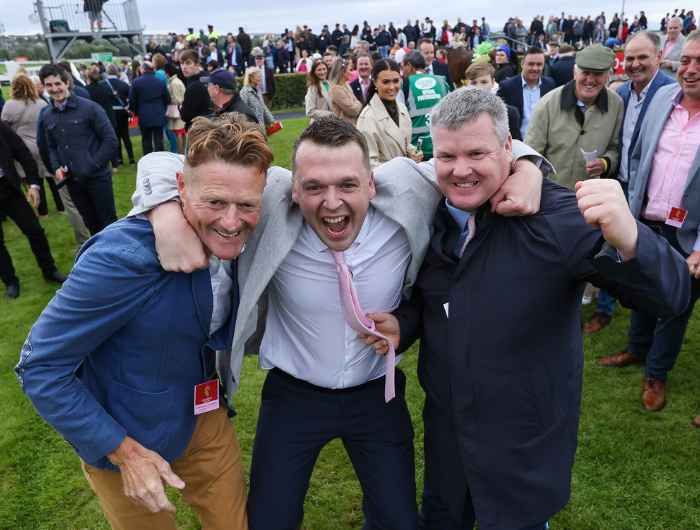 Owners with trainer Gordon Elliott celebrating win at the Galway races