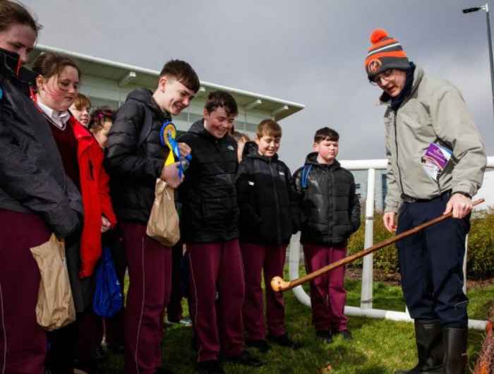 Primary school kids watch on as they learn about the fences