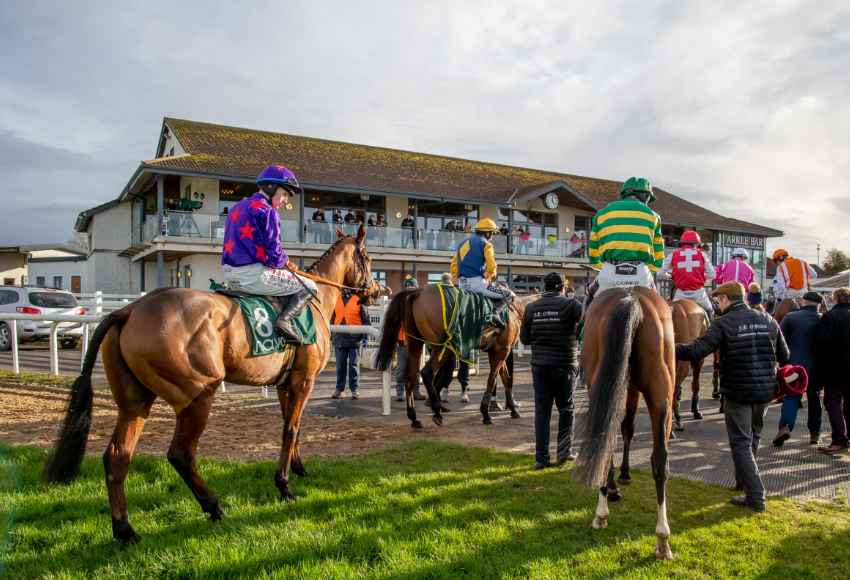 Jockeys and horses walking back into parade ring