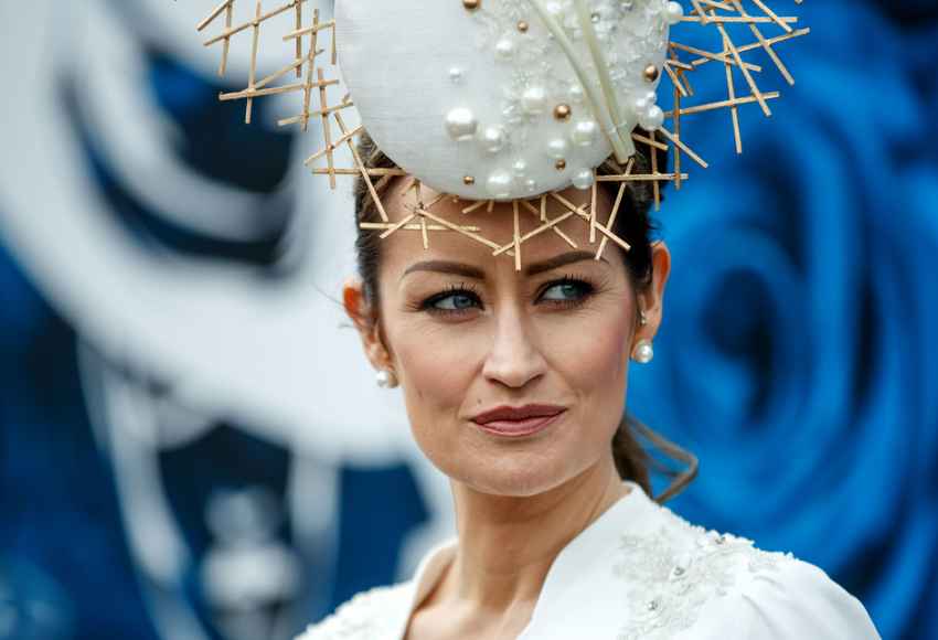 glamourous lady poses for a picture at Irish Champions Festival