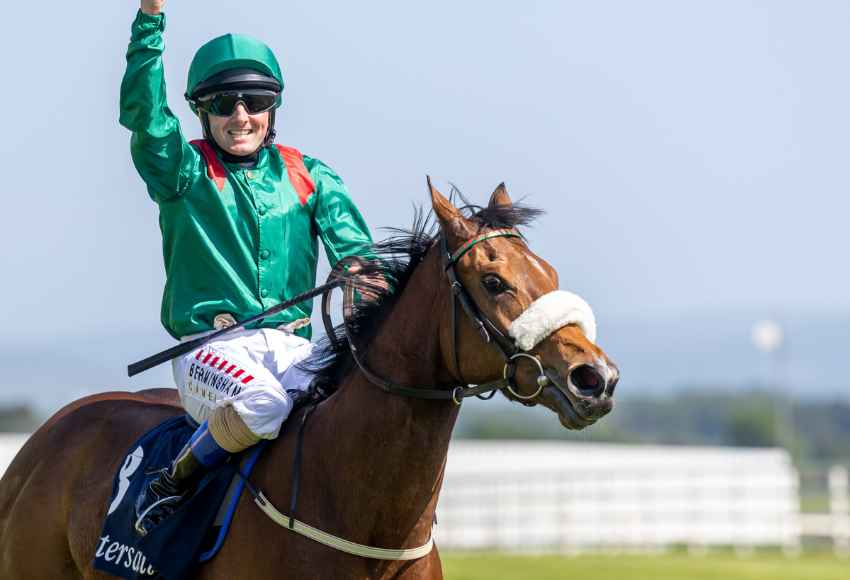 Chris Hayes celebrating on winning horse at Curragh