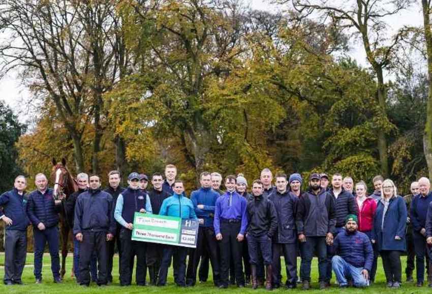 Staff from Jim Bolger's yard pose for camera as they won the 2021 best turned out league 