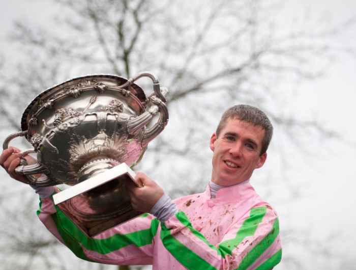 Derek O'Connor lifts trophy into the air